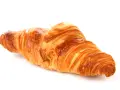 Un delizioso croissant francese, dorato e sfogliato, pronto per una colazione da sogno.