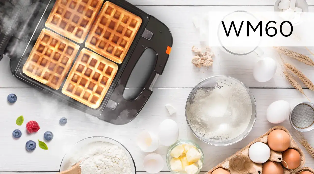Waffle appena sfornati nella piastra elettrica, pronti per una deliziosa ricetta. Ingredienti freschi come uova, farina e frutti di bosco completano la scena.